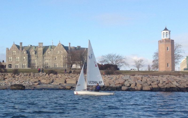 A photo of a sailboat sailing by the campus